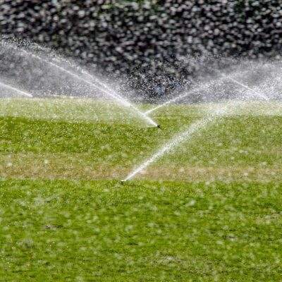 automatic sprinkler system watering lawn