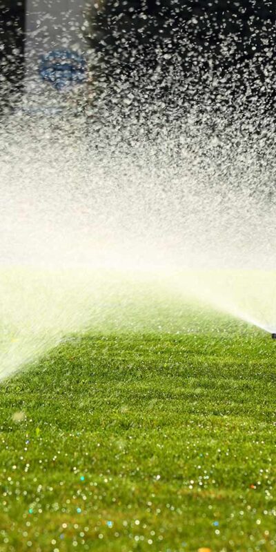 irrigation system watering a green lawn