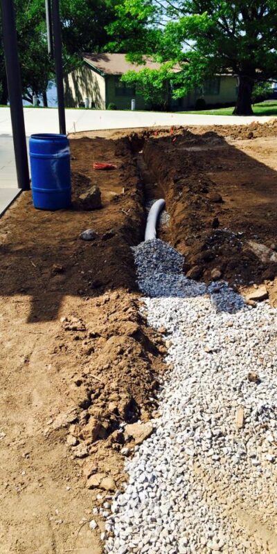 Aqueduct Irrigation pipes on a job site under gravel