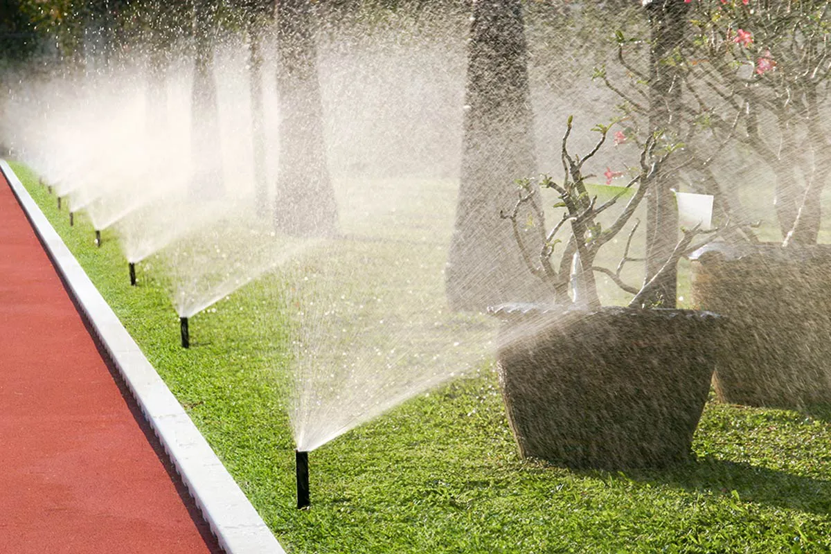 Irrigaton system sprinklers watering a commercial landscape