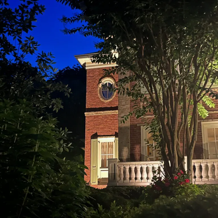 A Nashville home's exterior is lit by professional architectural lighting