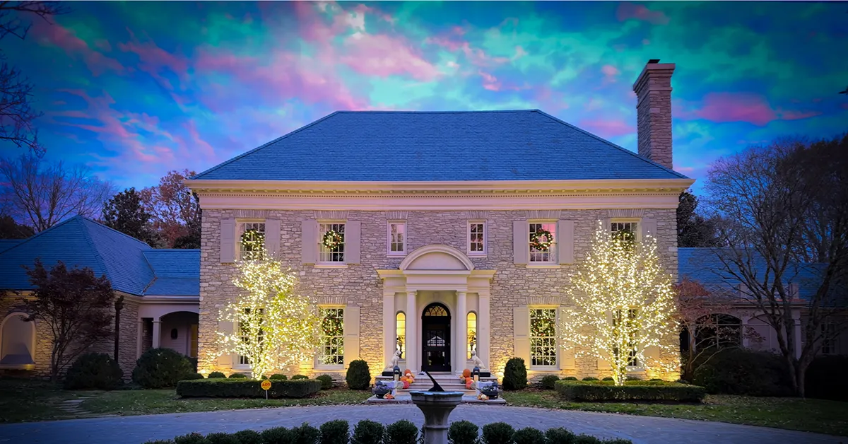 Nashville area home with professionally installed Christmas lights, including tree wrapping and wreaths on every window